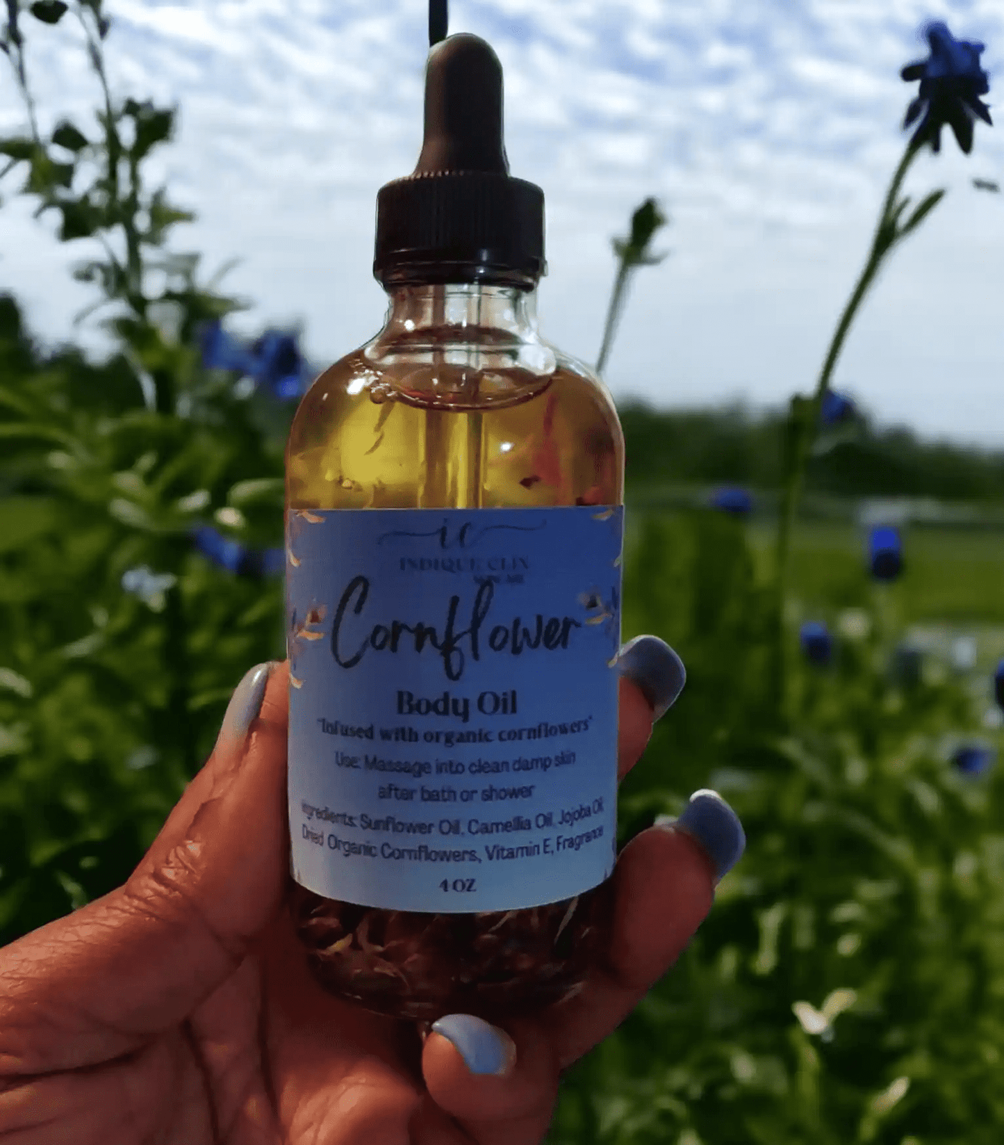 Bottle of cornflower infused body oil