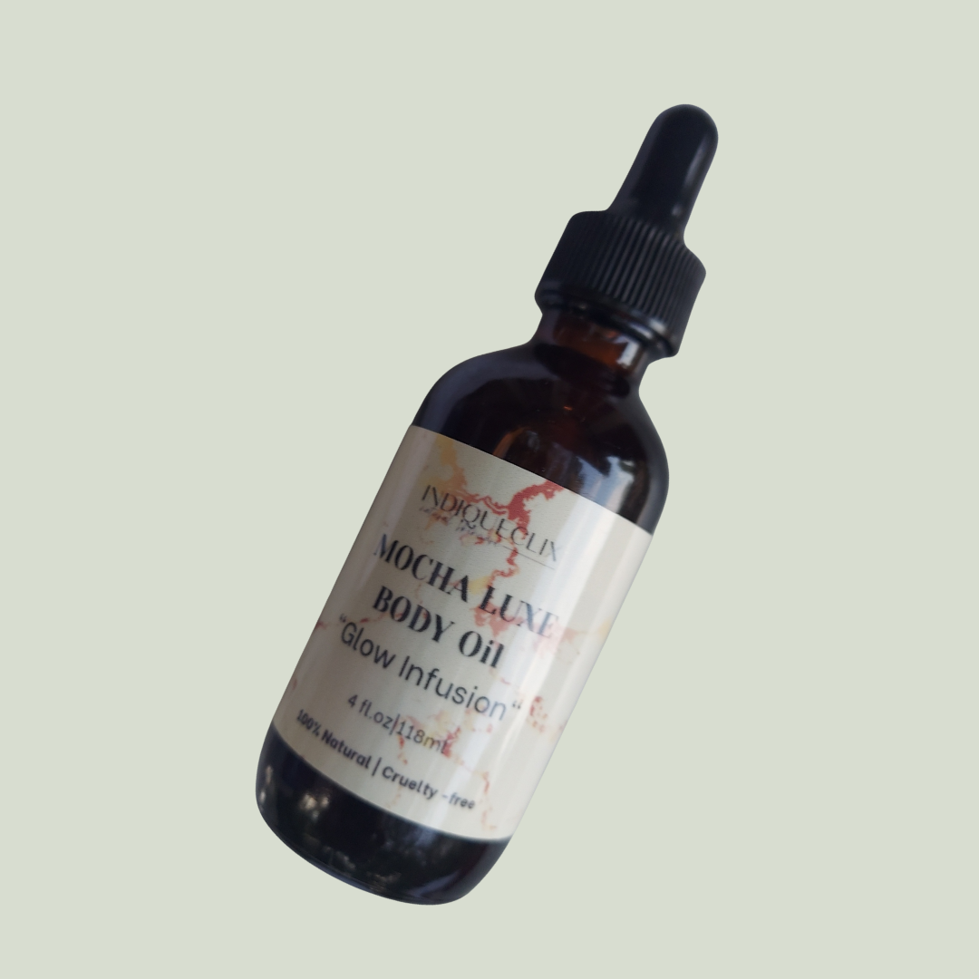 Bottle of Mocha Luxe Body Oil with a dropper on a light gray background